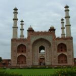 Sikandra, located near Agra, is home to the grand tomb of Emperor Akbar, one of India's most powerful Mughal rulers. Blending Mughal and Hindu architectural styles, the tomb reflects Akbar's vision of unity and tolerance. Surrounded by lush gardens, Sikandra is a serene symbol of his lasting legacy.