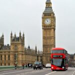 London in Motion - Big Ben and the iconic red bus, classic symbols of the city’s charm and history.
